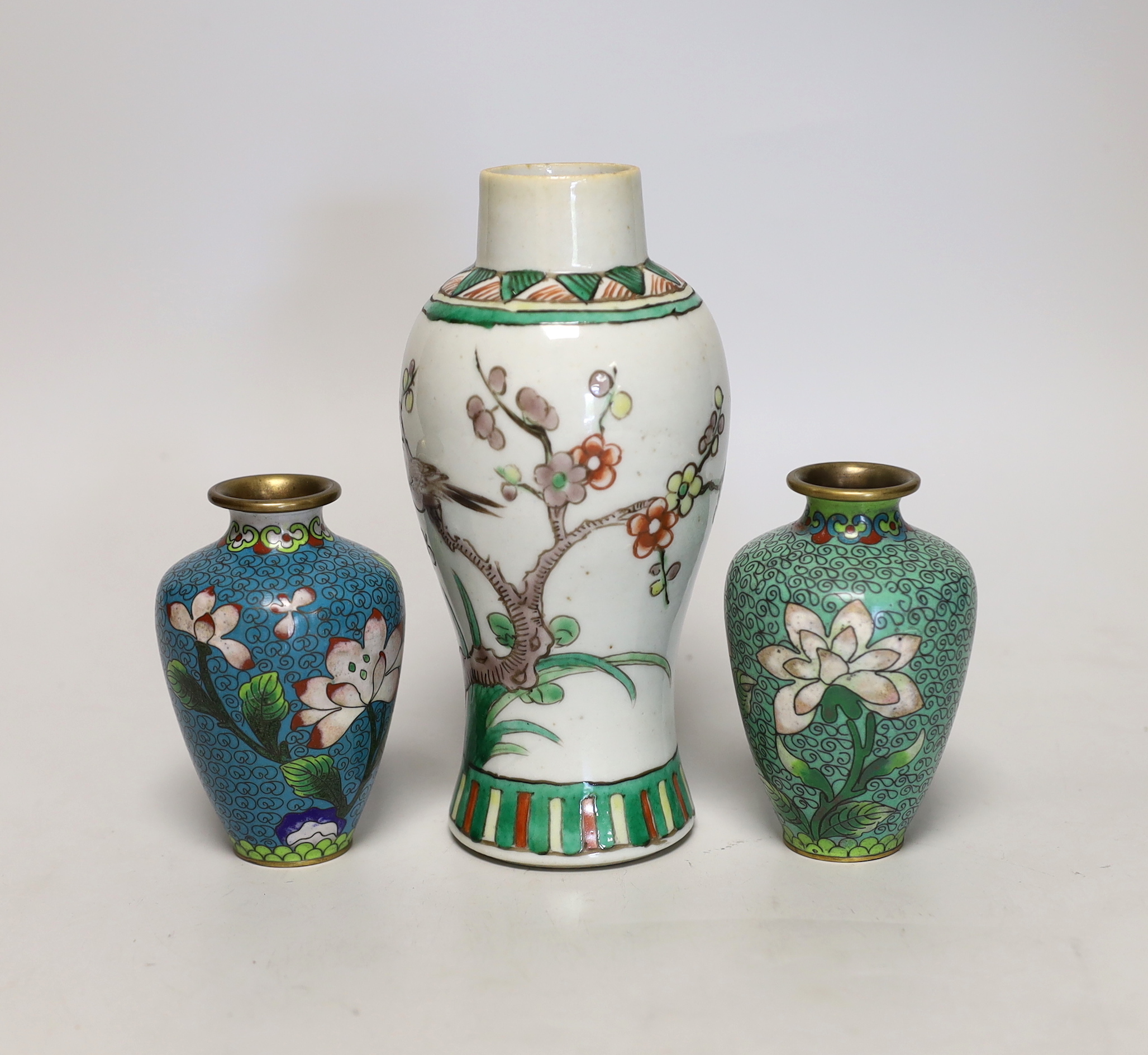 A Chinese famille verte small vase and a pair of cloisonné enamel vases, tallest 18cm high